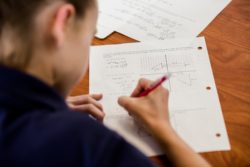 A student works on a mathematical problem